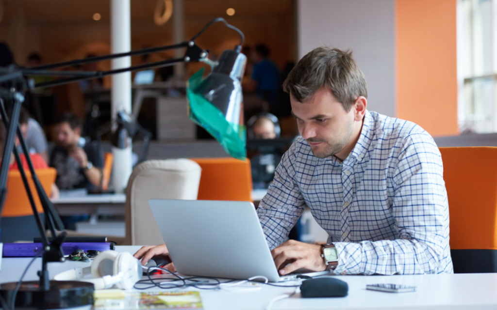 man working on notebook